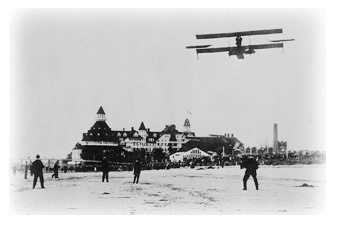 Early airplane and Hotel Del